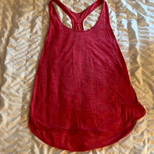 Very light weight tank top for working out. Nice dark pink color and flows out.